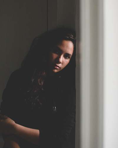 person standing woman leaning on wall human
