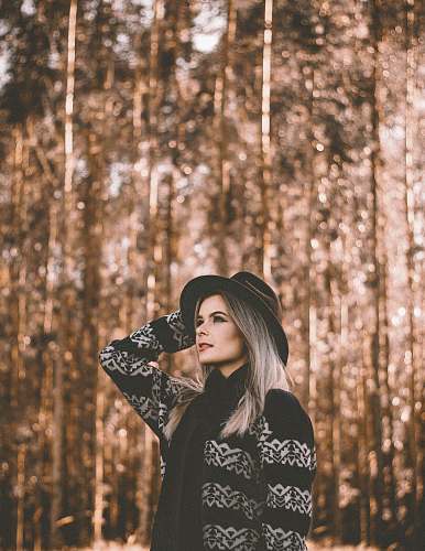 woman woman standing on forest sweater