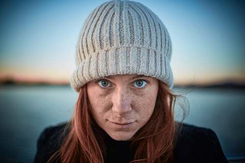 beanie woman wearing grey hat while selfie hat