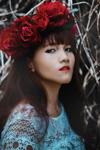 portrait woman wearing red flower crown human