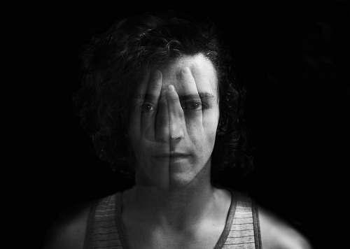 black-and-white grayscale photo of man in tank top face