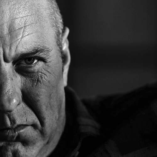 black-and-white grayscale photo of man's face portrait
