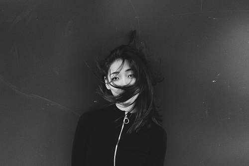 human grayscale photography of woman in shirt black-and-white