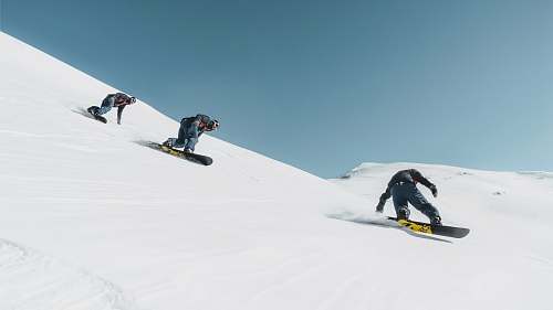 nature three person riding on snowboard sport