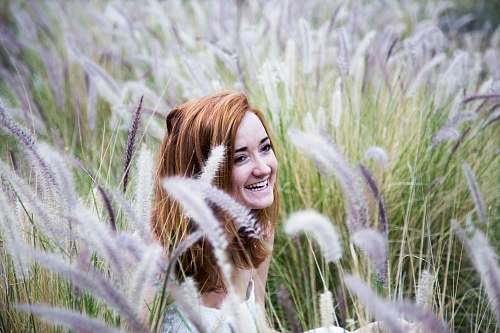 portrait woman sitting on grass field female