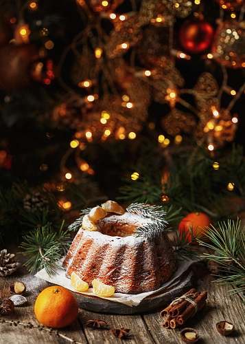  brown and white cake on white textile 