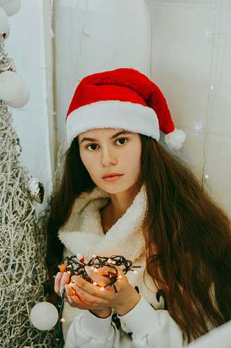 clothing woman holding string lights confectionery