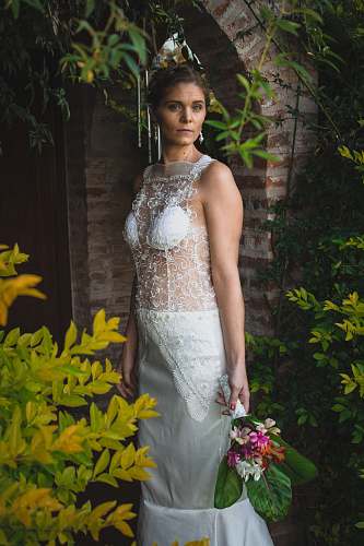 clothing woman standing beside flower fashion