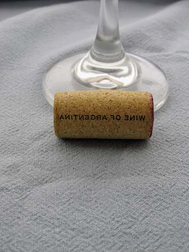 cork brown wine cork beside clear wine glass glass