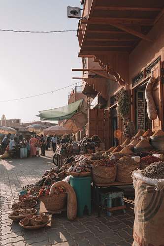 shop people in market selling goods during daytime human