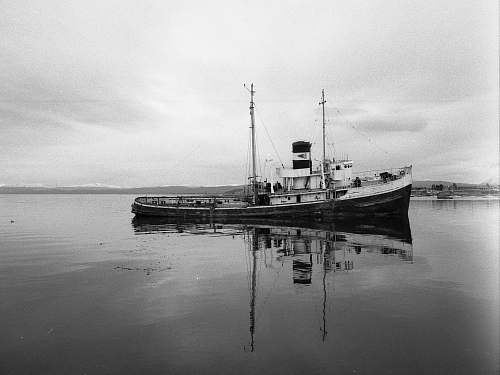 steamer grayscale photo of fishing vessel on body of water ushuaia