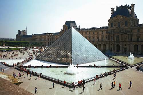 architecture people walking around pyramid landmark city