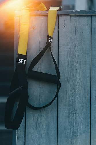 strap black and yellow TRX resistance band fence