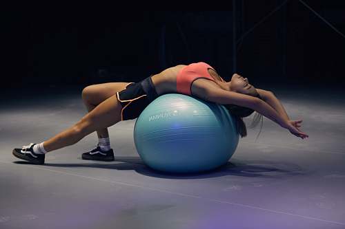 sport woman doing yoga on stability ball exercise