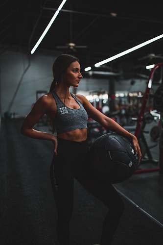 person woman standing and holding ball human