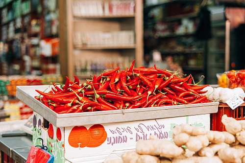 person red chili pile on gray steel tray human