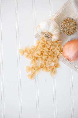 vegetable ribbon pasta beside garlic and onion garlic