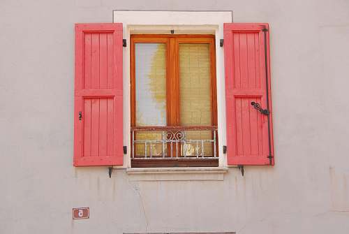 window opened red wooden window doors shutters