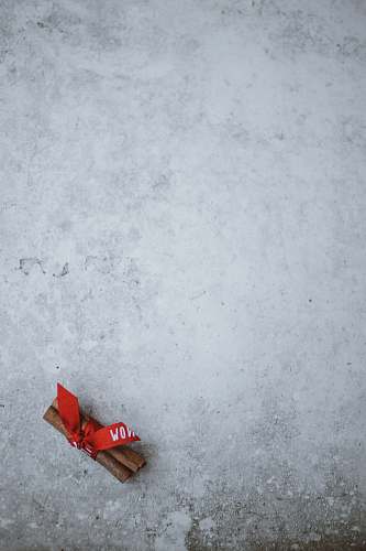 christmas red ribon on snow cinnamon