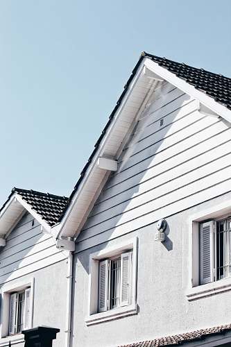 window wooden house during day roof