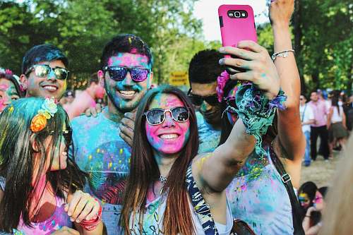 person group of people taking groufie with face paints on their face people