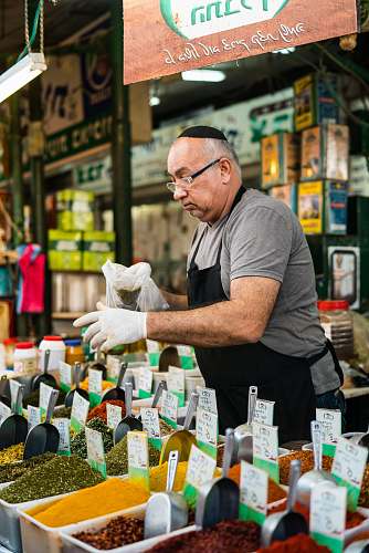 person man selling assorted seeds people