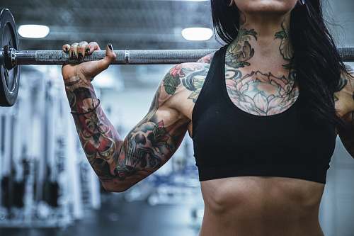 person woman carrying barbell people