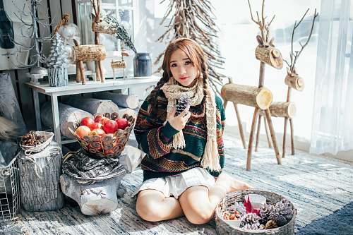 person woman kneeling near table plant