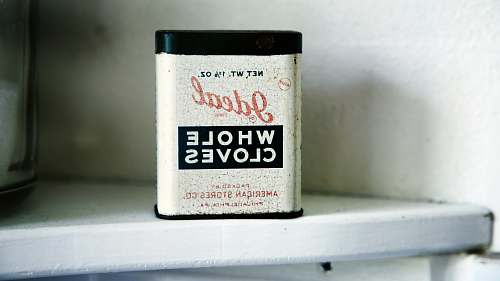 vintage Ideal Whole Cloves case on white shelf tin