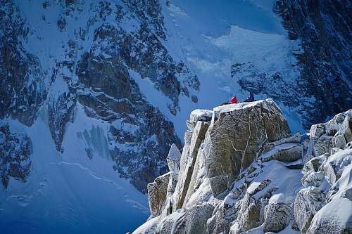 snow person standing on top of snowy mountain chamonix