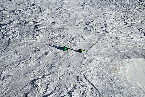outdoors person sitting on snow covered field mountain