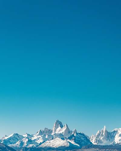 outdoors snow capped mountain range mountain