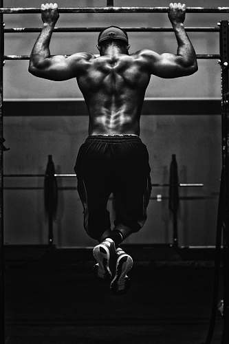 fitness grayscale photo of man working out black-and-white