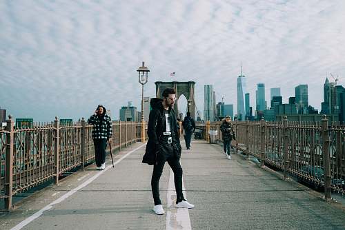 people man standing on bridge human