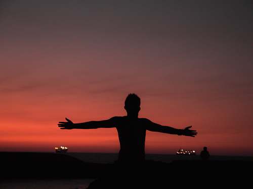 fitness silhouette of man spreading both arms working out