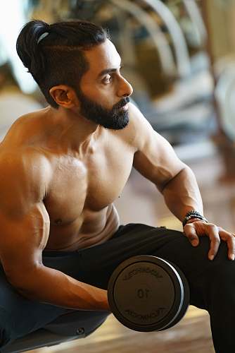 human topless man holding dumbbell exercise