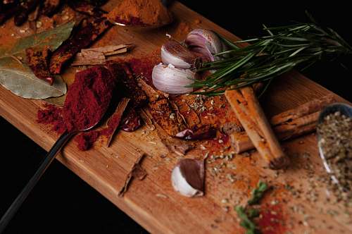 food view of sliced red onions paprika and bay leaves wood