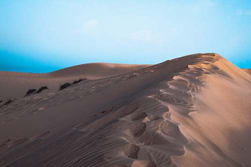nature desert dunes photo during daytime outdoors
