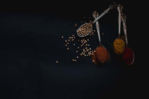 natural four stainless steel spoons with condiments natural spice