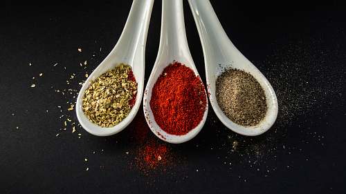 brown three assorted spices in white spoons 