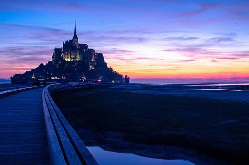 architecture concerete castle during night time castle