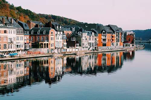 canal assorted-color of houses near lake dinant