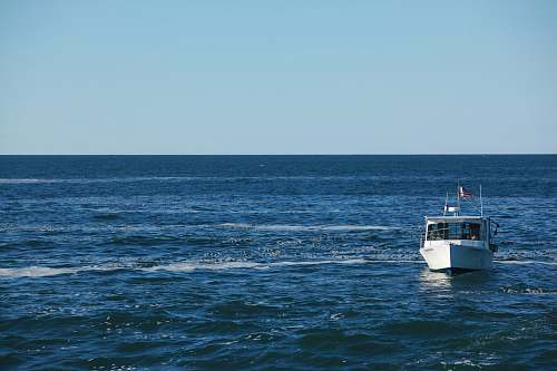 sea white motorboat at water ocean