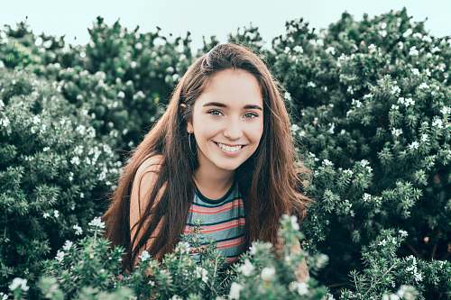 people woman standing in bushes person