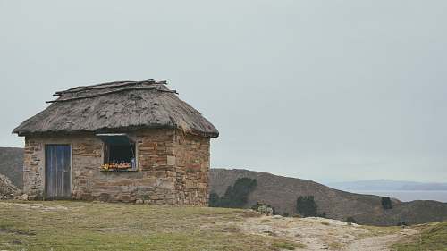 building brown brick house hut