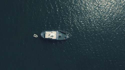boat aerial photography of sailing boat in water water