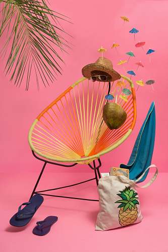 mexico blue flip-flop beside chair pink