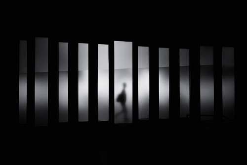 black-and-white grayscale photo of person running in panel paintings black
