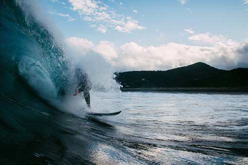 water surfer surfing on tidal wave surf