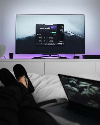 listening flat screen TV turned on room